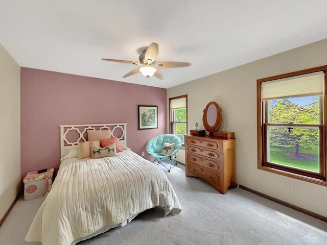 2307 W Willow Creek Ln, Sheboygan, WI 53083 - bedroom with multiple windows, light carpet, and ceiling fan