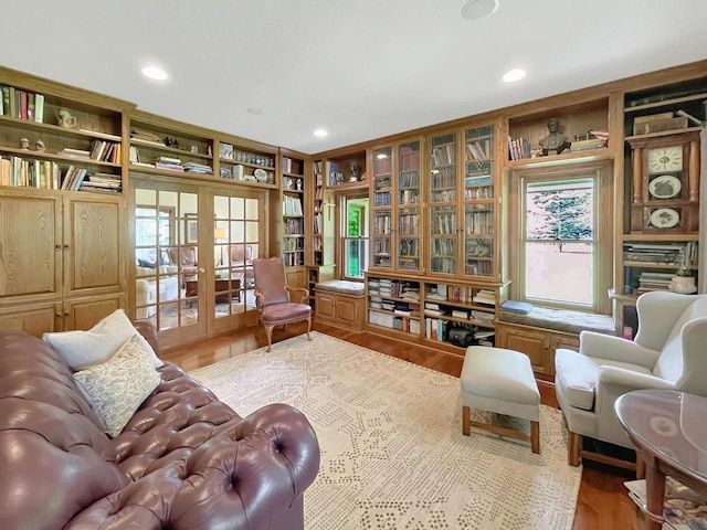 2307 W Willow Creek Ln, Sheboygan, WI 53083 - living area featuring wood finished floors, french doors, plenty of natural light, and recessed lighting