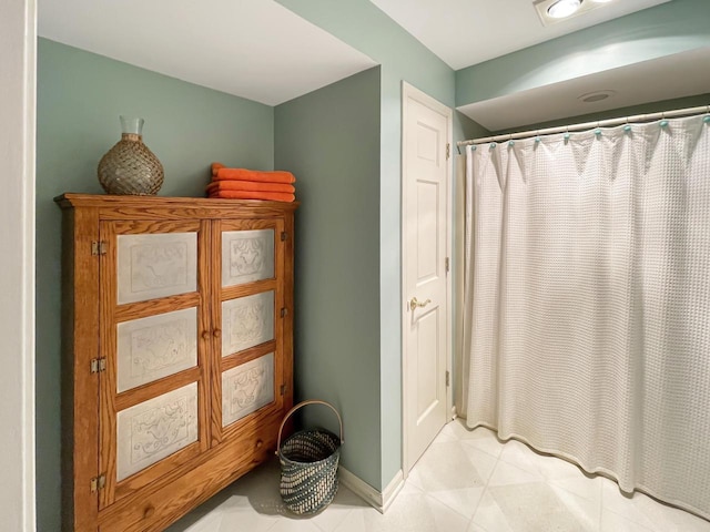2307 W Willow Creek Ln, Sheboygan, WI 53083 - bathroom featuring a shower with shower curtain and tile patterned flooring