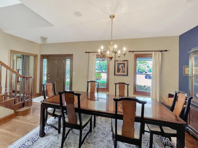 2307 W Willow Creek Ln, Sheboygan, WI 53083 - dining room featuring a chandelier and stairs