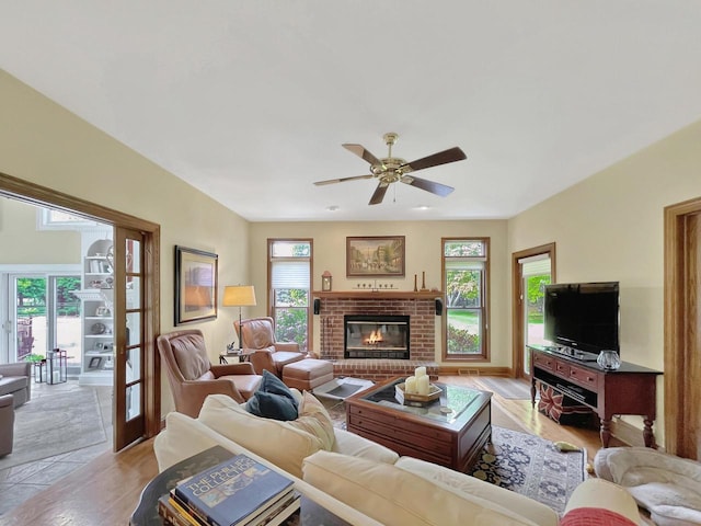 2307 W Willow Creek Ln, Sheboygan, WI 53083 - living room featuring ceiling fan, healthy amount of natural light, light wood-style flooring, and french doors