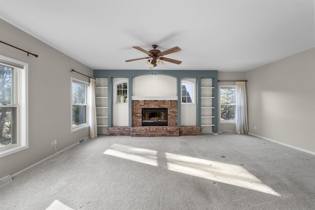 4227 Savannah Ct, Middleton, WI 53562 - unfurnished living room with plenty of natural light, a fireplace, and carpet