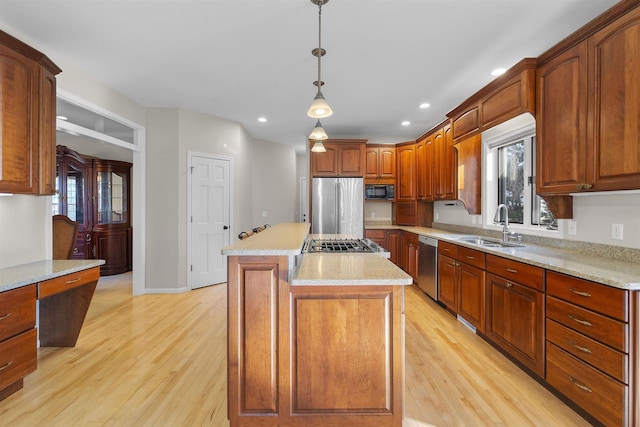 4227 Savannah Ct, Middleton, WI 53562 - kitchen featuring appliances with stainless steel finishes, light wood finished floors, hanging light fixtures, recessed lighting, and plenty of natural light