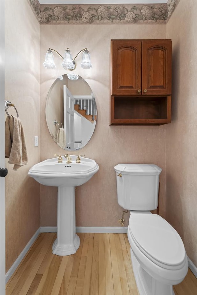 4227 Savannah Ct, Middleton, WI 53562 - half bathroom with wood finished floors and toilet