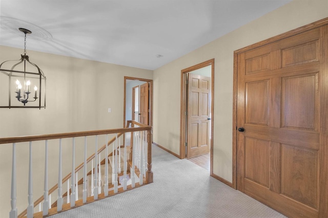 4227 Savannah Ct, Middleton, WI 53562 - hall featuring an upstairs landing, a chandelier, and light carpet