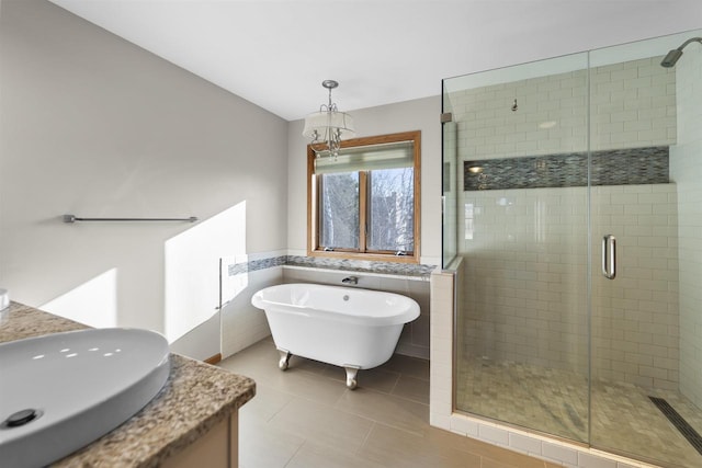 4227 Savannah Ct, Middleton, WI 53562 - bathroom with a shower stall, a soaking tub, vanity, tile patterned flooring, and tile walls