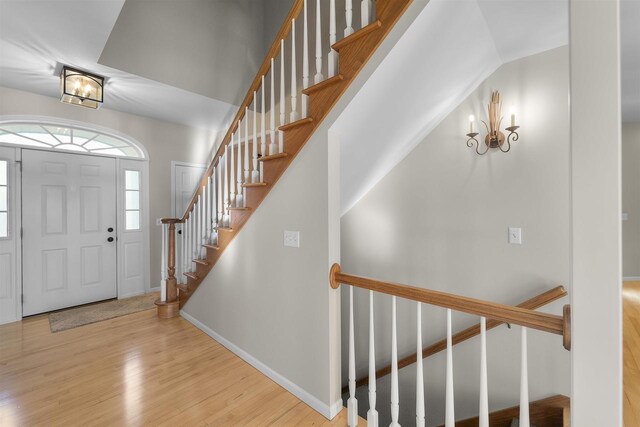 4227 Savannah Ct, Middleton, WI 53562 - foyer with wood finished floors, a chandelier, and stairs