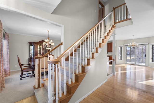 4227 Savannah Ct, Middleton, WI 53562 - stairs featuring a chandelier and wood finished floors