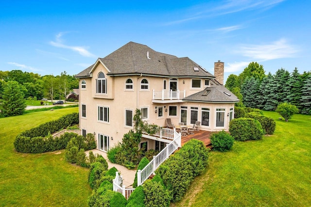 1626 Fox Hollow Ln, Cedarburg, WI 53012 - back of property with a balcony, stucco siding, a lawn, a chimney, and a deck