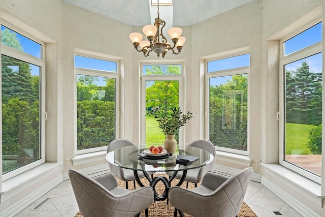 1626 Fox Hollow Ln, Cedarburg, WI 53012 - sunroom featuring tile patterned floors, plenty of natural light, and a chandelier