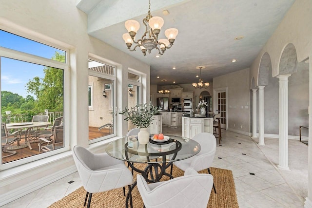 1626 Fox Hollow Ln, Cedarburg, WI 53012 - dining area with a chandelier, light tile patterned floors, recessed lighting, and decorative columns