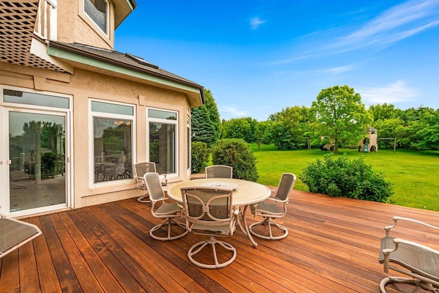 1626 Fox Hollow Ln, Cedarburg, WI 53012 - wooden deck with outdoor dining area, a yard, and view of scattered trees