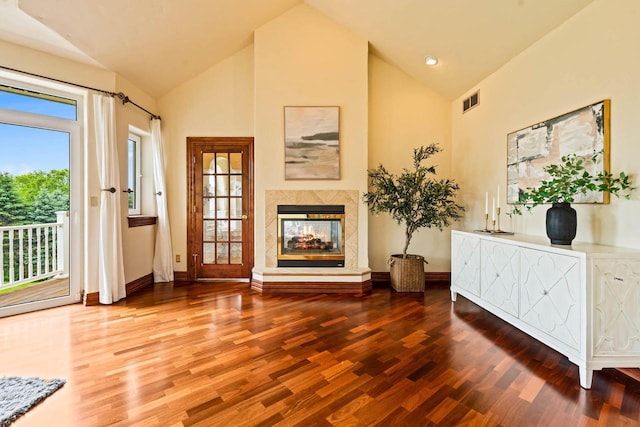 1626 Fox Hollow Ln, Cedarburg, WI 53012 - living room featuring wood finished floors, high vaulted ceiling, and a multi sided fireplace