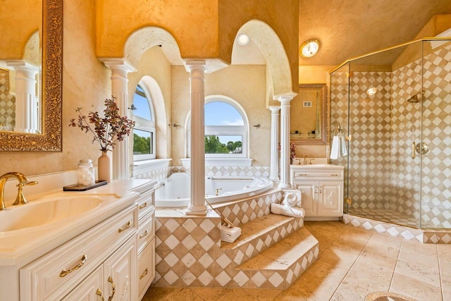 1626 Fox Hollow Ln, Cedarburg, WI 53012 - full bath with decorative columns, two vanities, a garden tub, and a stall shower