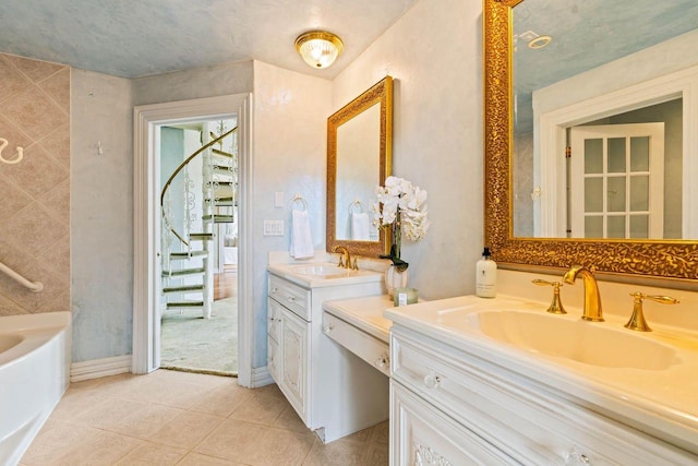 1626 Fox Hollow Ln, Cedarburg, WI 53012 - full bathroom with two vanities, a bathtub, and tile patterned flooring