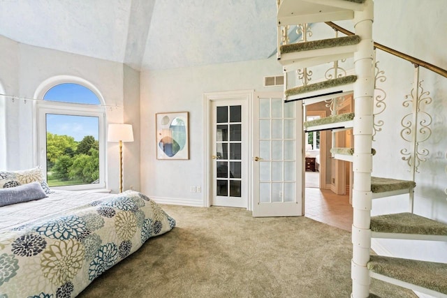 1626 Fox Hollow Ln, Cedarburg, WI 53012 - bedroom with carpet, multiple windows, french doors, and high vaulted ceiling