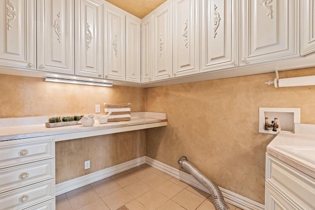 1626 Fox Hollow Ln, Cedarburg, WI 53012 - laundry area featuring cabinet space, light tile patterned flooring, and hookup for a washing machine