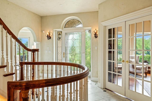 1626 Fox Hollow Ln, Cedarburg, WI 53012 - foyer with french doors, healthy amount of natural light, and light tile patterned floors