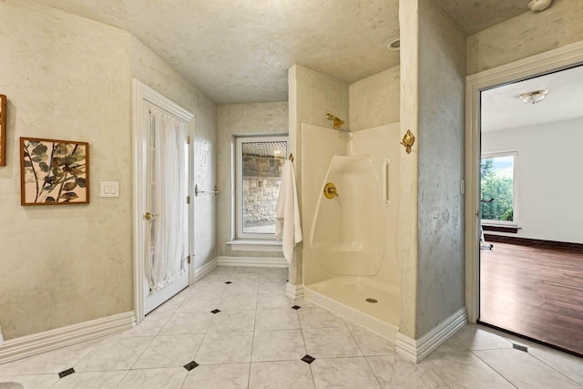 1626 Fox Hollow Ln, Cedarburg, WI 53012 - bathroom with a shower and baseboards