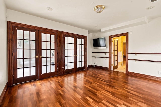 1626 Fox Hollow Ln, Cedarburg, WI 53012 - empty room featuring french doors, wood finished floors, and plenty of natural light