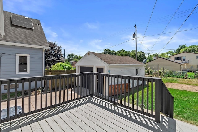 3009 N 72nd St, Milwaukee, WI 53210 - wooden deck featuring a detached garage and an outbuilding