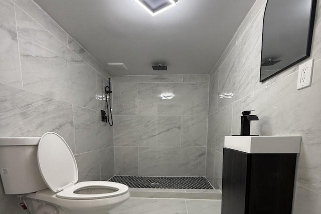 3009 N 72nd St, Milwaukee, WI 53210 - bathroom with a tile shower, marble finish floors, and vanity