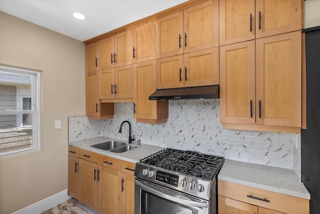 3009 N 72nd St, Milwaukee, WI 53210 - kitchen with stainless steel gas range oven, under cabinet range hood, backsplash, light marble finish flooring, and recessed lighting
