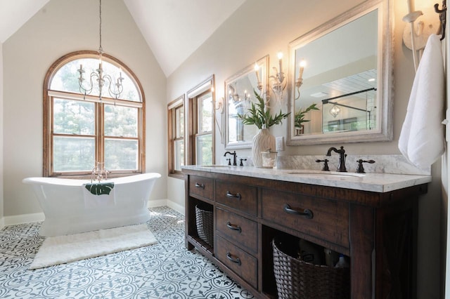 N69W29753 Ridgeview Ct, Hartland, WI 53029 - bathroom with lofted ceiling, a freestanding tub, double vanity, and a shower