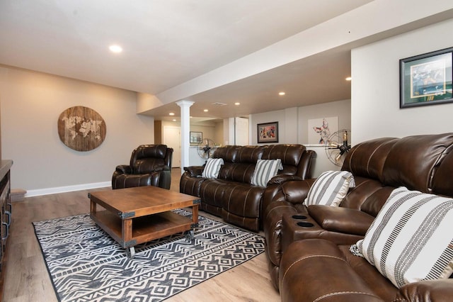 N69W29753 Ridgeview Ct, Hartland, WI 53029 - living room featuring decorative columns, wood finished floors, and recessed lighting