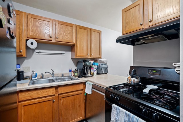 4050 W Rivers Edge Cir Unit 25, Brown Deer, WI 53209 - kitchen with gas range oven, under cabinet range hood, freestanding refrigerator, and light countertops