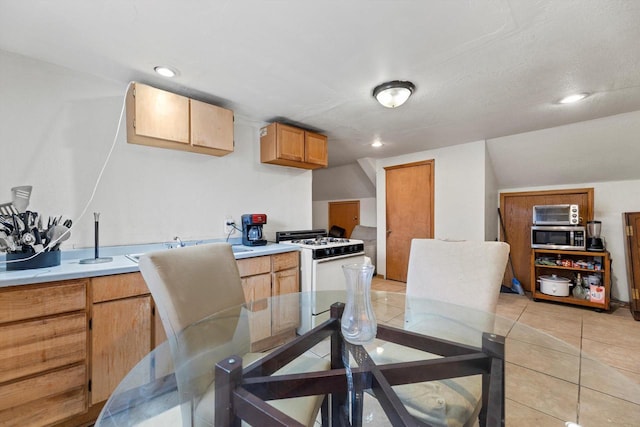 3946 N 25th St, Milwaukee, WI 53206 - dining room with light tile patterned floors and recessed lighting