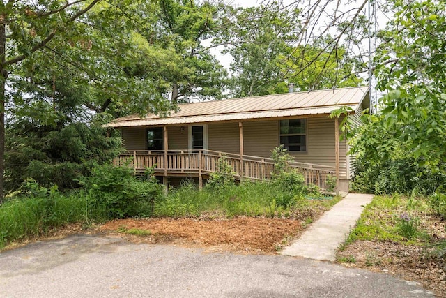 N5642 8th Dr, Westfield, WI 53964 - view of front of home featuring covered porch and a metal roof