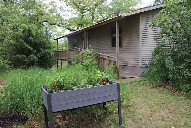 N5642 8th Dr, Westfield, WI 53964 - view of side of home with a wooden deck