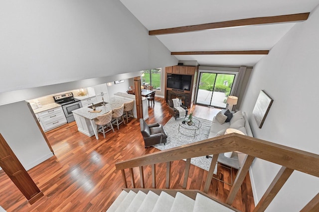836 Pilgrim Pkwy, Elm Grove, WI 53122 - living area with light wood-style flooring and a glass covered fireplace
