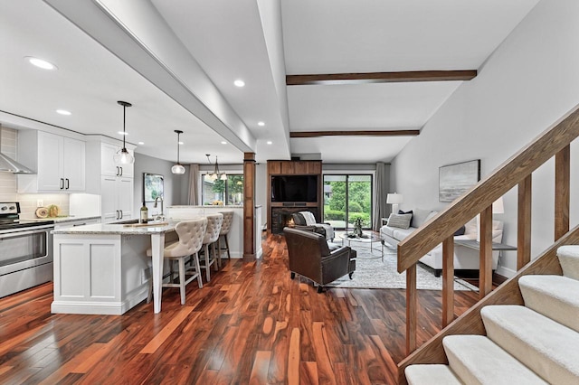 836 Pilgrim Pkwy, Elm Grove, WI 53122 - living area featuring recessed lighting, dark wood-type flooring, beamed ceiling, and stairway
