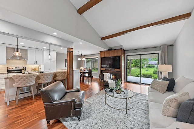 836 Pilgrim Pkwy, Elm Grove, WI 53122 - living area featuring light wood-style floors, ornate columns, and recessed lighting