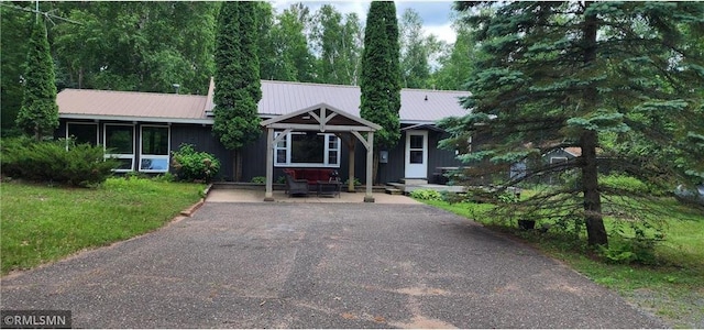 2818 Wilson Ave, Saint Croix Falls, WI 54024 - ranch-style house with a metal roof