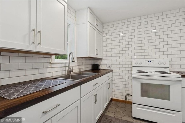 2818 Wilson Ave, Saint Croix Falls, WI 54024 - kitchen featuring electric range, wooden counters, white cabinetry, decorative backsplash, and tile walls