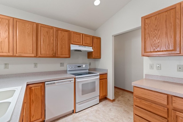 7062 S Fieldstone Ct, Franklin, WI 53132 - kitchen featuring white appliances, under cabinet range hood, light countertops, vaulted ceiling, and brown cabinets