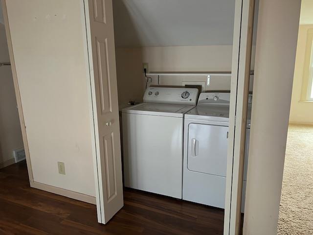 1153 W 7th Ave, Oshkosh, WI 54902 - washroom featuring washing machine and dryer and dark wood-style floors