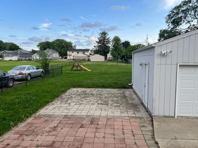1153 W 7th Ave, Oshkosh, WI 54902 - view of patio / terrace with a playground and a residential view