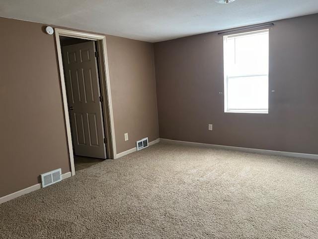 1153 W 7th Ave, Oshkosh, WI 54902 - carpeted spare room with baseboards