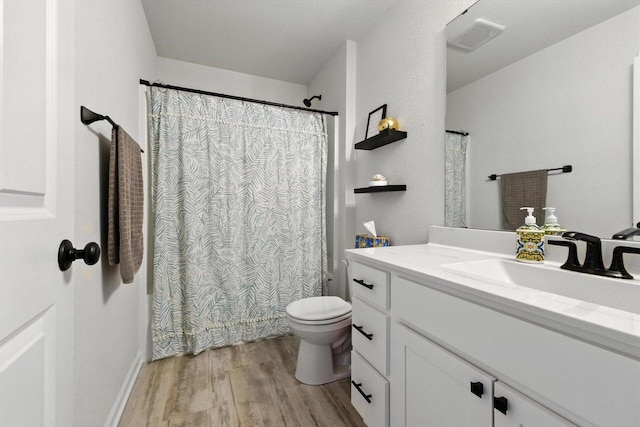 1143 Juniper Ln, Oconomowoc, WI 53066 - full bath with wood finished floors, vanity, and a shower with shower curtain