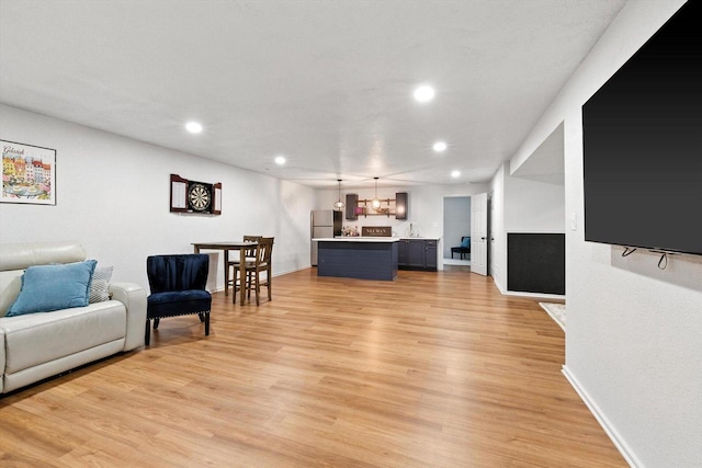 1143 Juniper Ln, Oconomowoc, WI 53066 - living area featuring recessed lighting, light wood-style flooring, and a chandelier