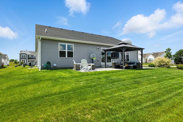 1143 Juniper Ln, Oconomowoc, WI 53066 - back of property featuring a patio area, a gazebo, and a yard
