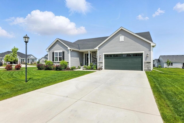 1143 Juniper Ln, Oconomowoc, WI 53066 - ranch-style house with an attached garage, a front yard, stone siding, and driveway