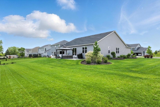 1143 Juniper Ln, Oconomowoc, WI 53066 - rear view of property with a gazebo and a patio area
