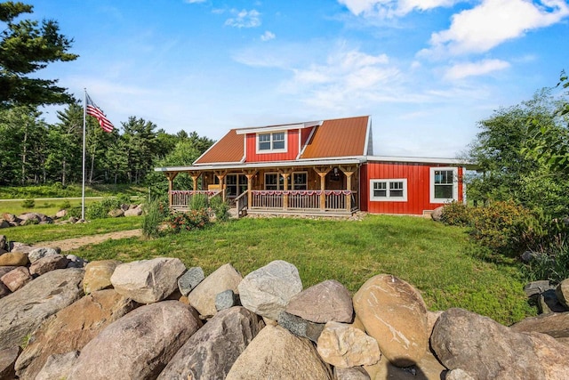 W1511 County Rd Hh, Fremont, WI 54940 - view of front of property with covered porch, a metal roof, and a front yard