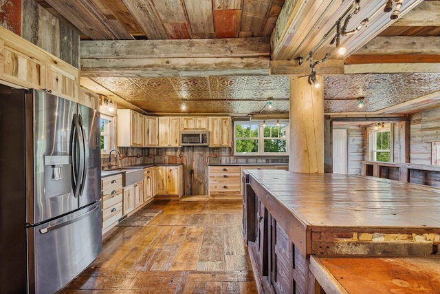 W1511 County Rd Hh, Fremont, WI 54940 - kitchen featuring appliances with stainless steel finishes, light brown cabinetry, hardwood / wood-style flooring, plenty of natural light, and wooden ceiling