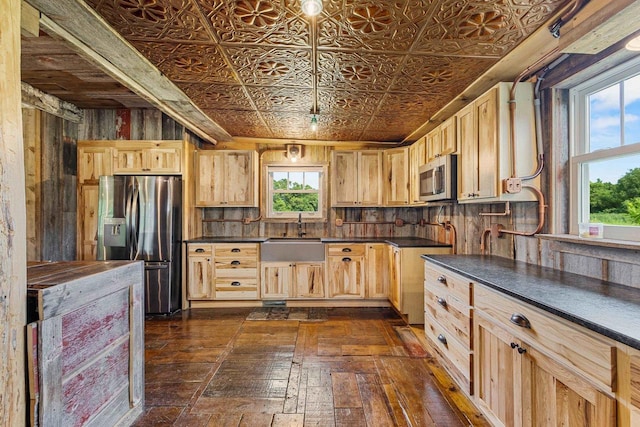 W1511 County Rd Hh, Fremont, WI 54940 - kitchen featuring appliances with stainless steel finishes, dark countertops, light brown cabinets, and an ornate ceiling